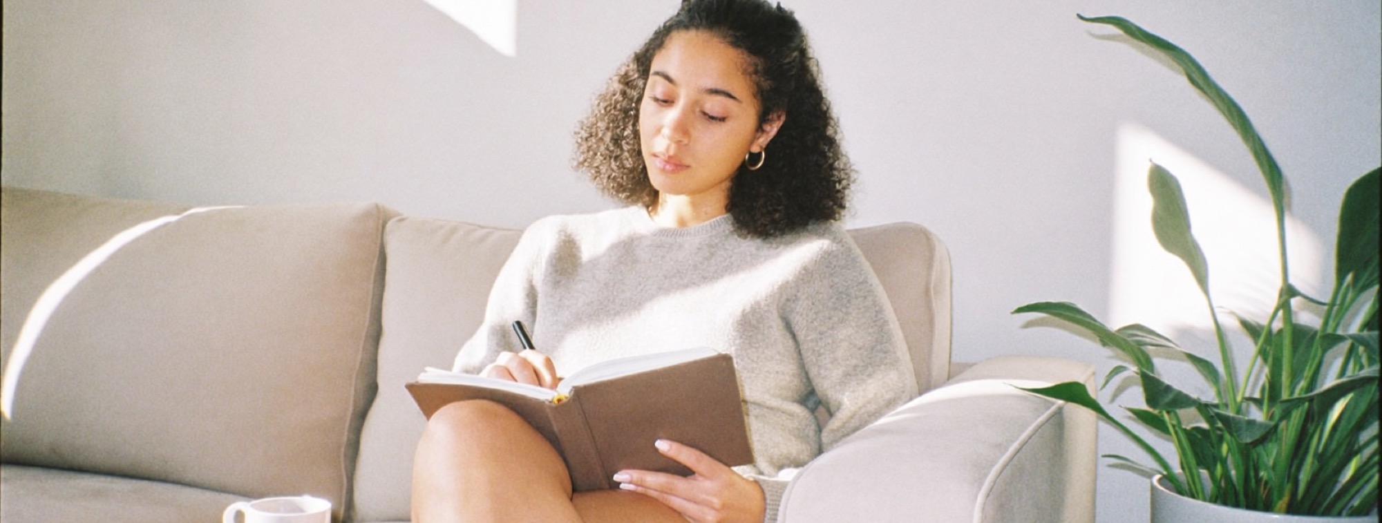 A creator on the sofa thinking an idea through before she records