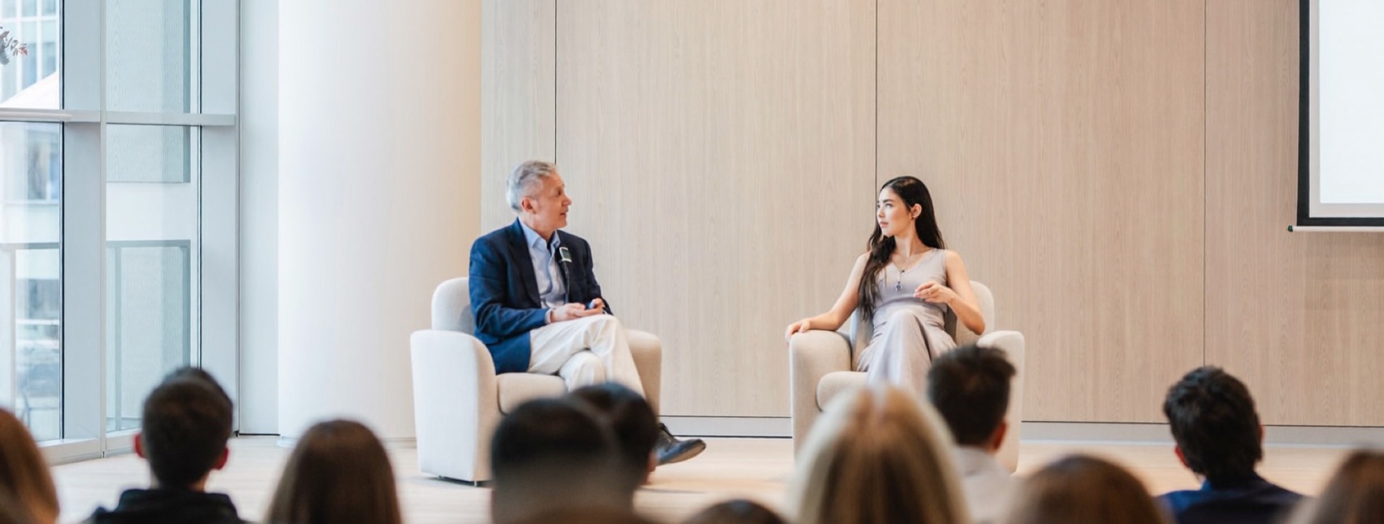 A founder speaking on stage to an audience, the credibility from his coverage put to work