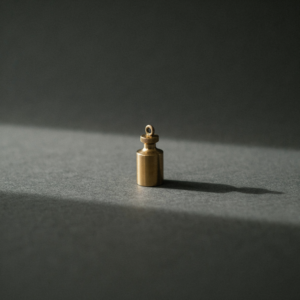 A single brass weight on a dark surface, what a small business actually weighs