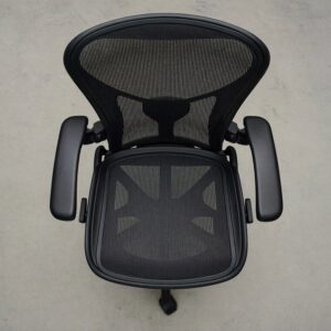 A single empty office chair seen from above