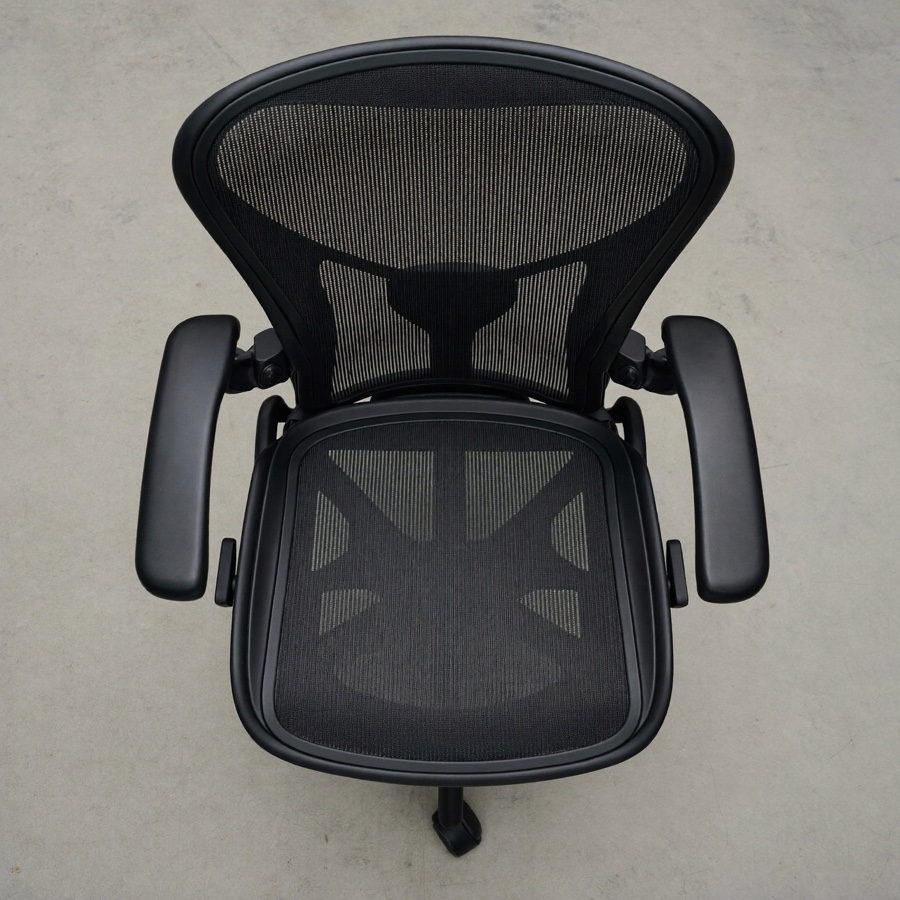 A single empty office chair seen from above
