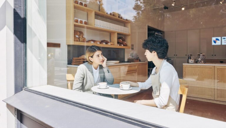 How to get your first clients: a consultant listening to a bakery owner in her own shop