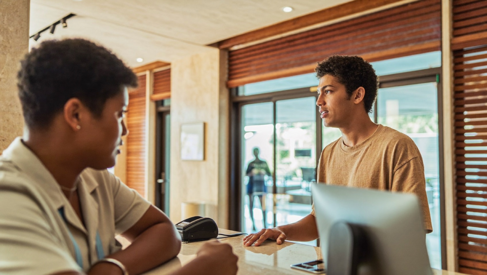 A guest checking in at a hotel desk, where a credit for the year gets used or wasted