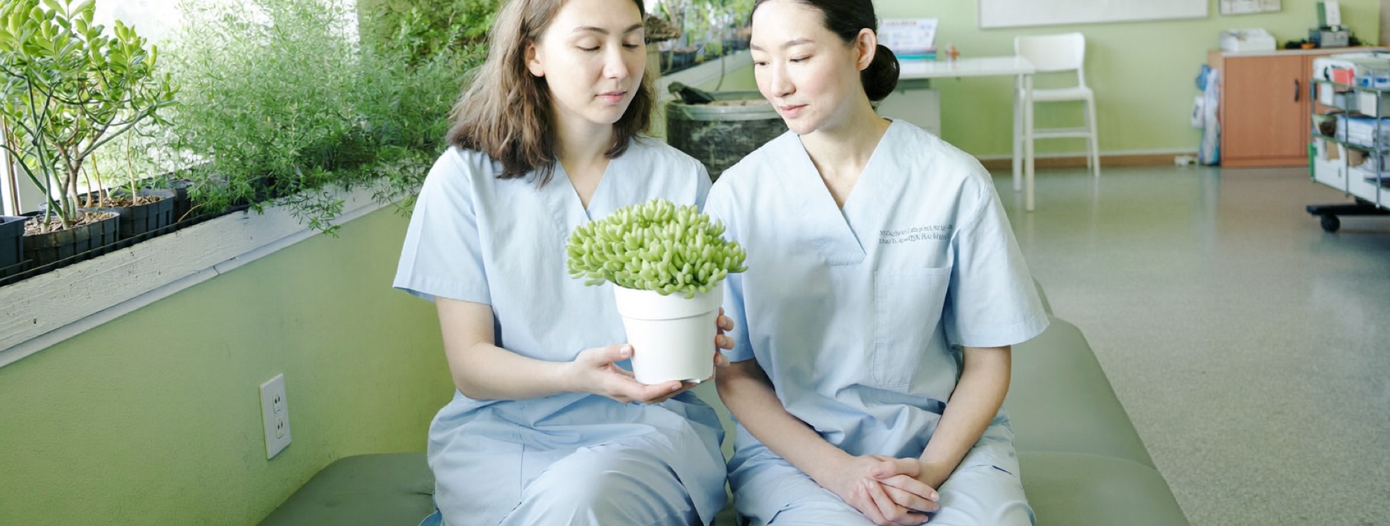 Two nurses sitting together in a staff room, the professions where burnout runs highest