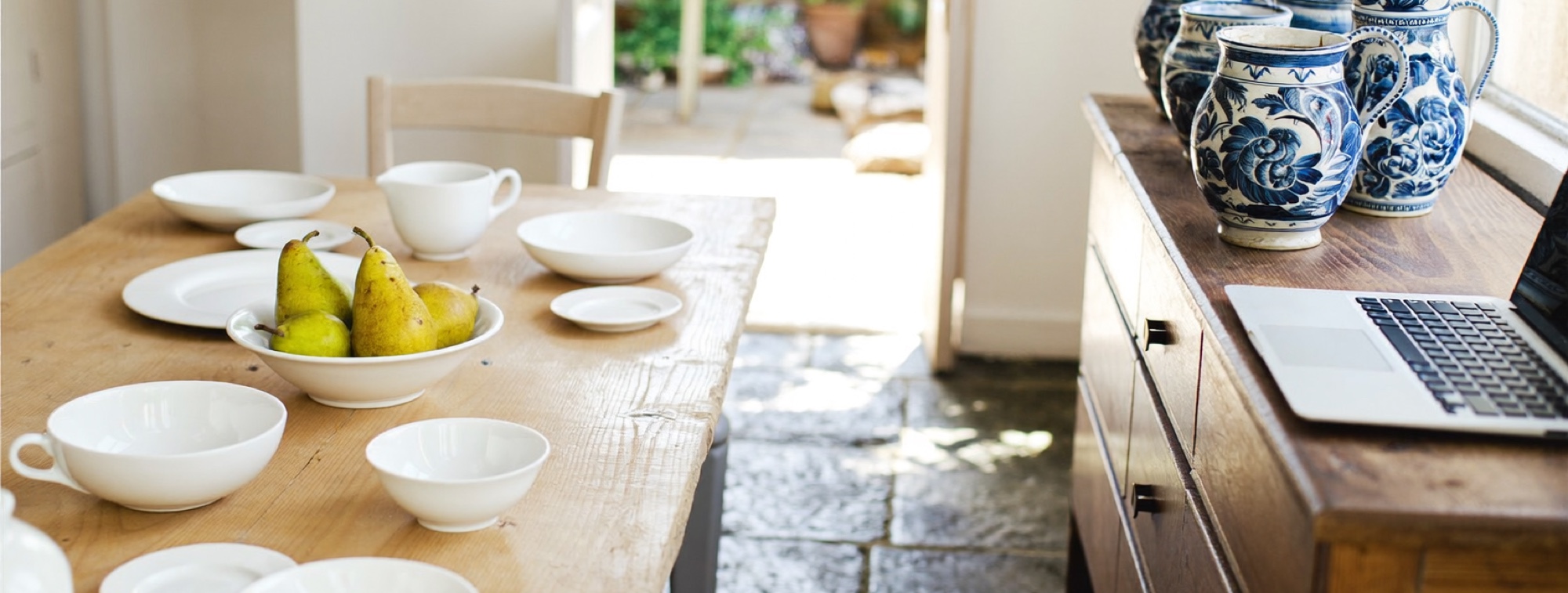A breakfast table laid for two with the laptop shelved, a work life balance rule in one picture