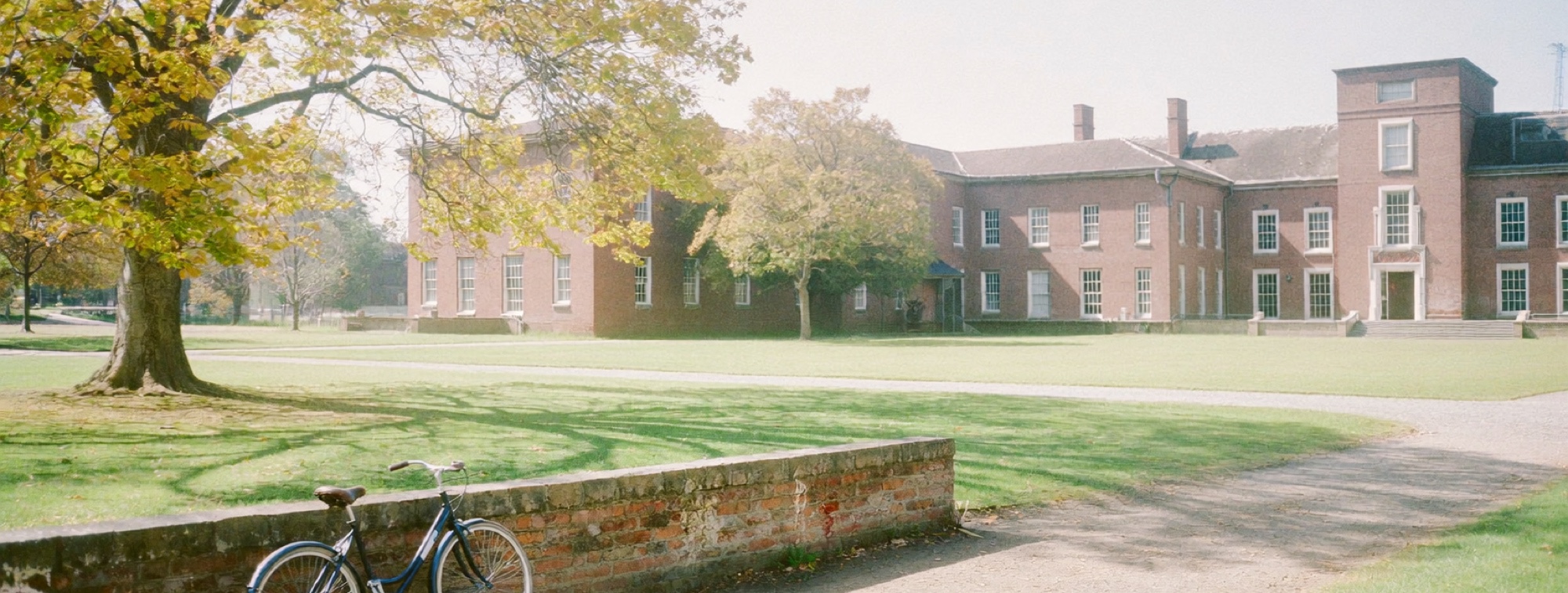 A university quadrangle, the campus an MBA candidate pictures before the cost sheet arrives