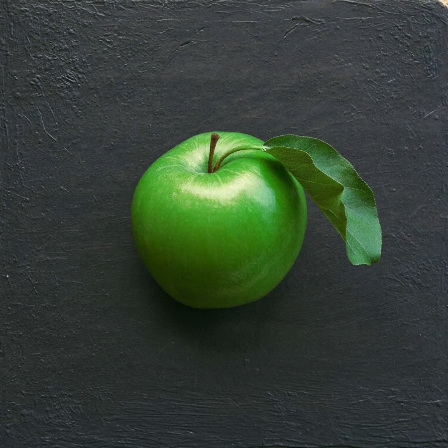 A green apple, the oldest symbol of paying for an education