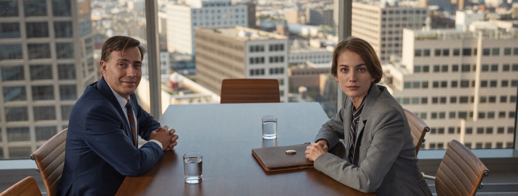 A chief executive and her finance director at the boardroom table before a decision