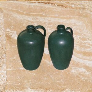 Two stoneware jugs of different sizes, the same money in two different containers