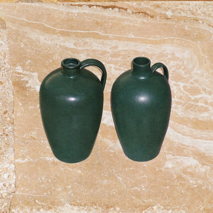 Two stoneware jugs of different sizes, the same money in two different containers