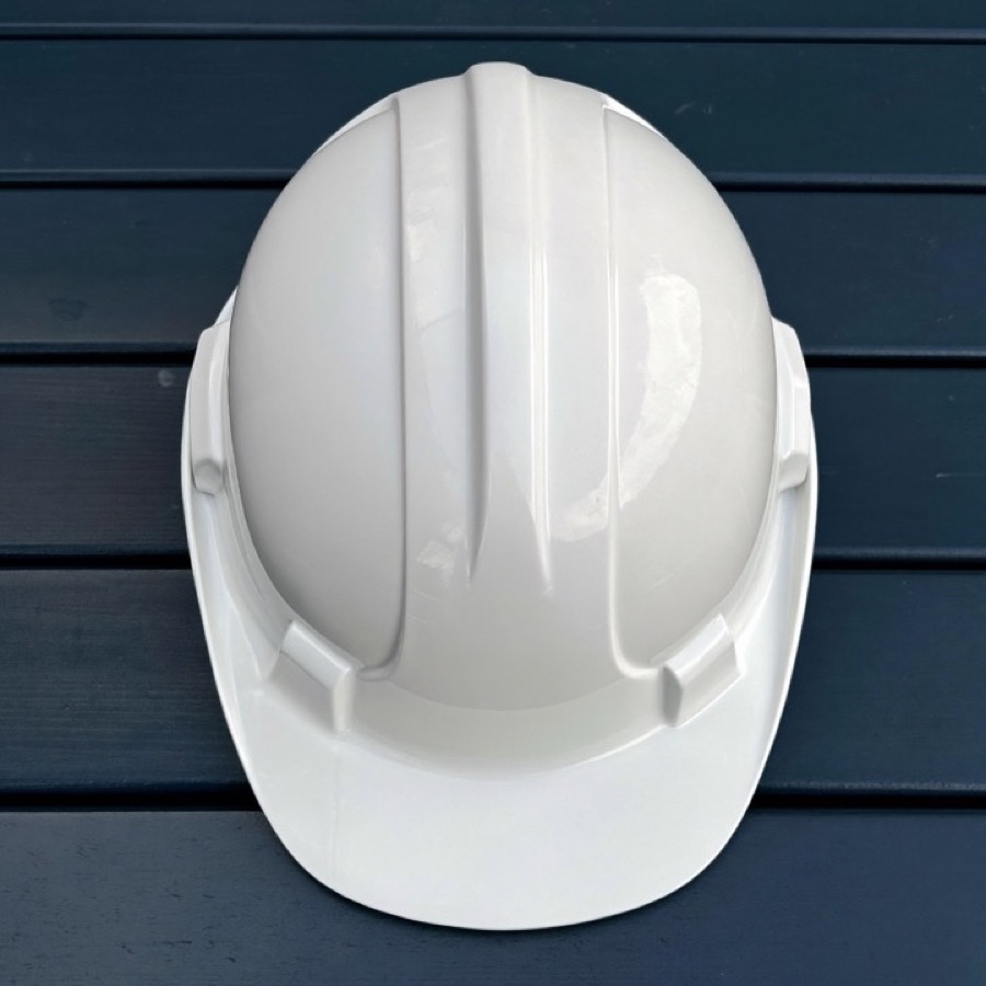 A new white hard hat, the first day in a different career