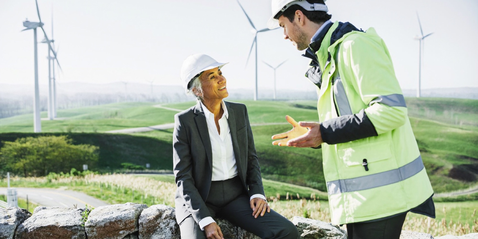 A senior hire learning a new industry on site from a younger engineer