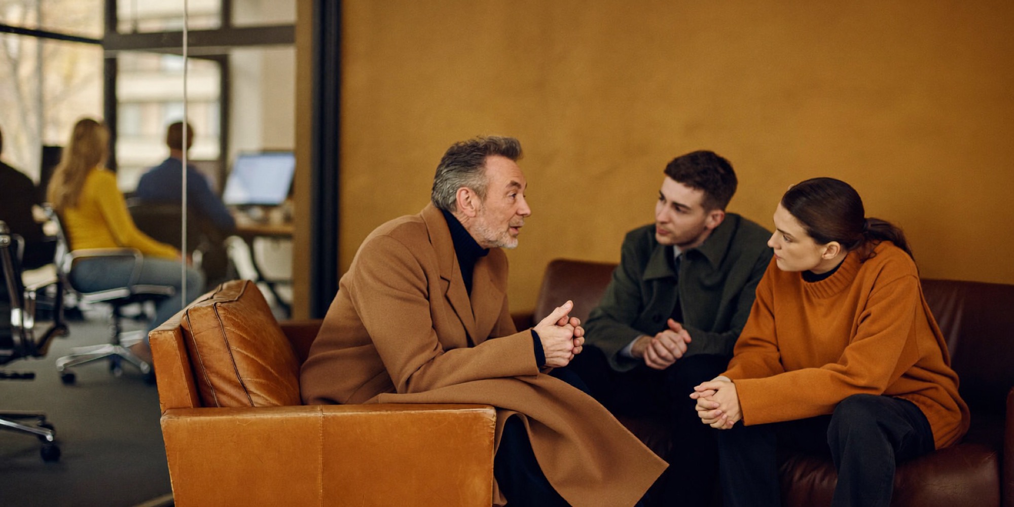 An experienced executive in his fifties advising two young founders in his new career