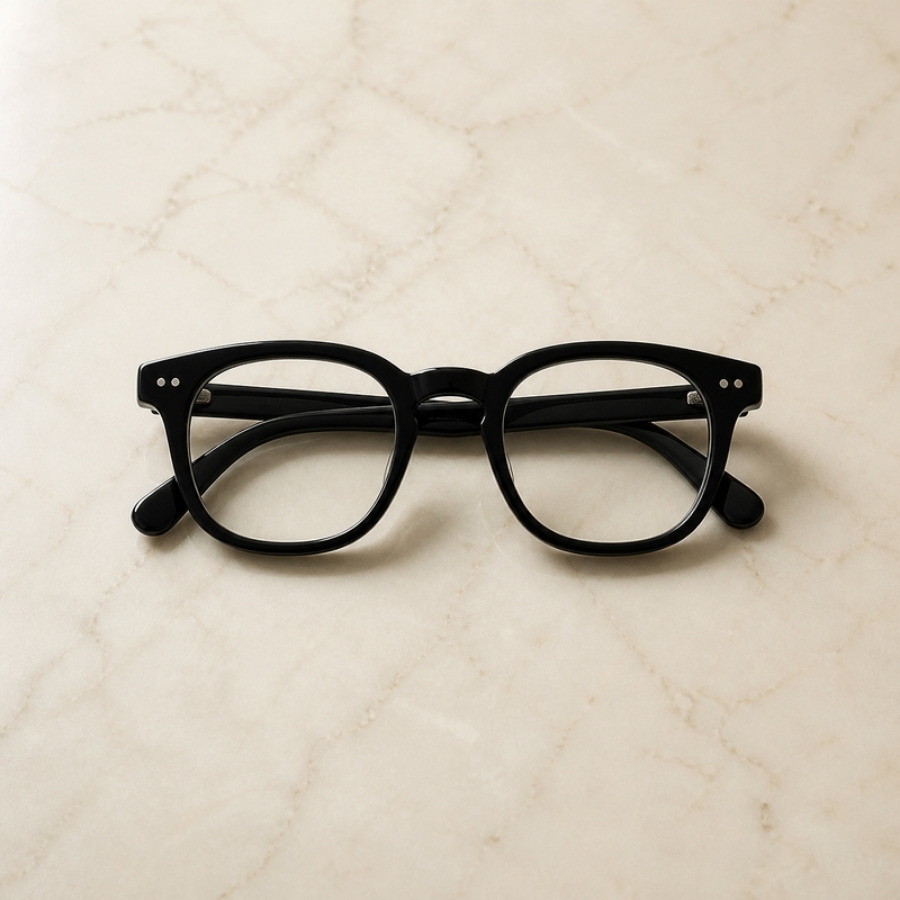 Heavy black glasses of the kind Charlie Munger wore, for his mental models