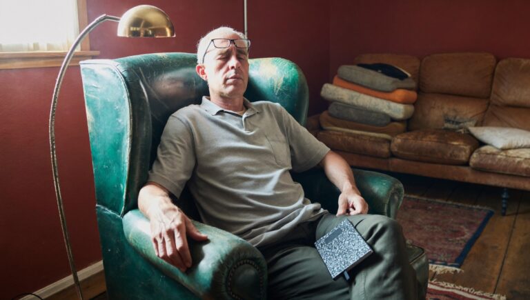 A man in his reading chair, a daily slot is the first step in how to read more books