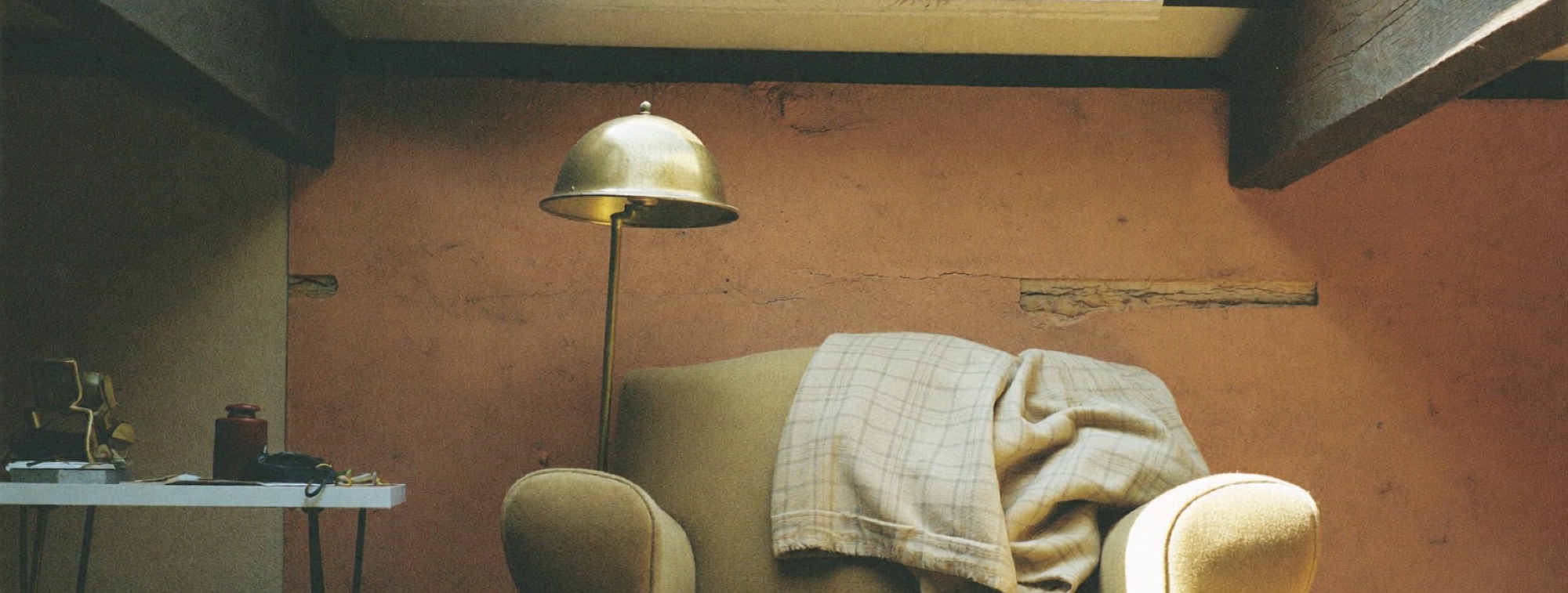 A quiet attic reading chair under a skylight