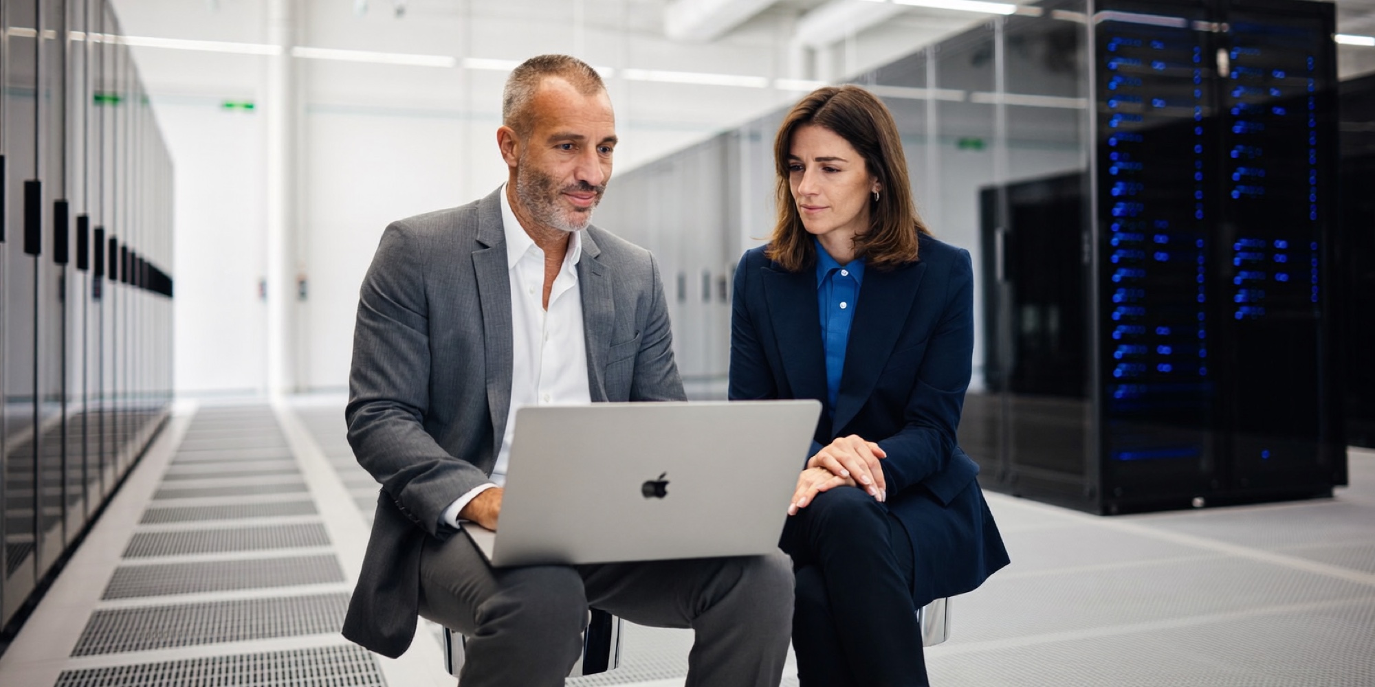 An infrastructure director and a contract engineer working through a migration in the data centre