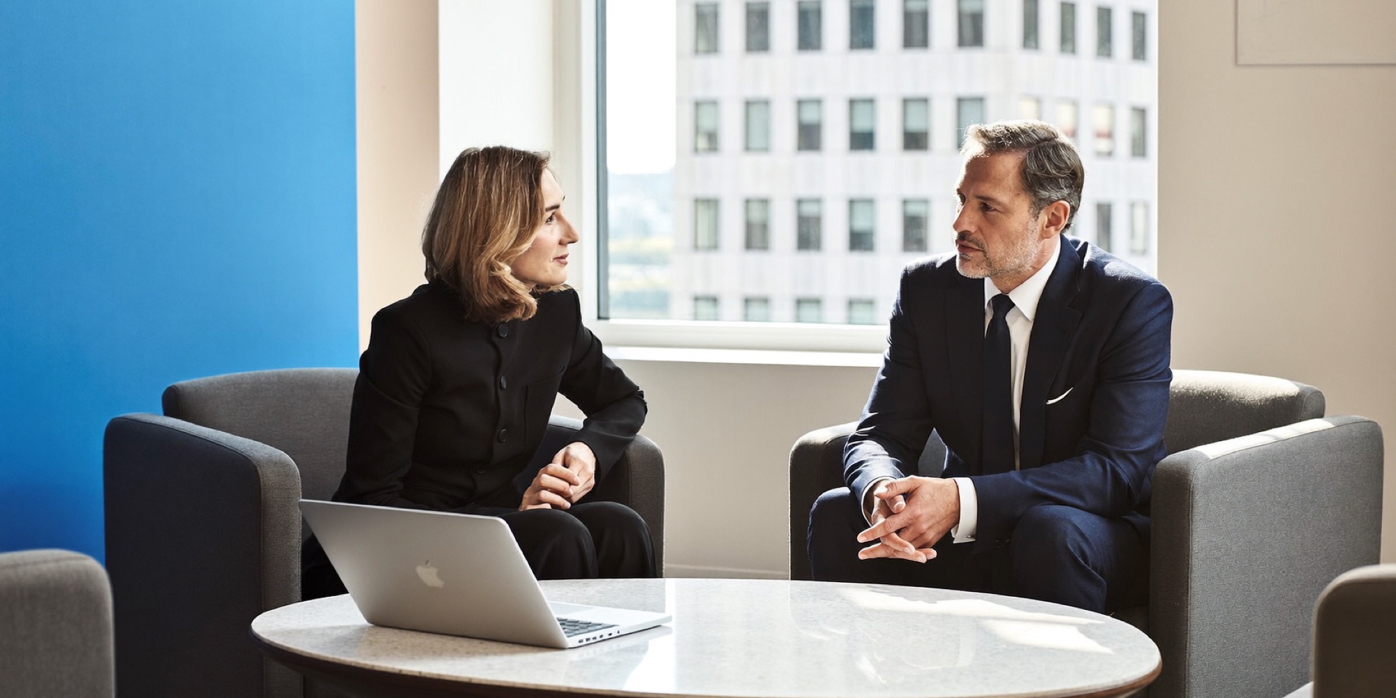 A candidate making his case to a hiring director in her office