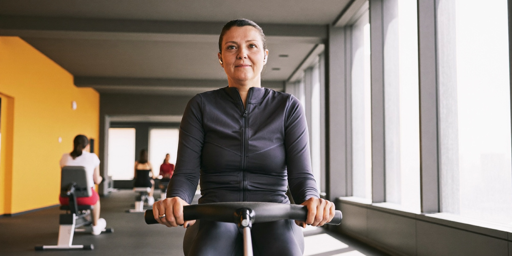 An executive listening to a podcast during a morning workout