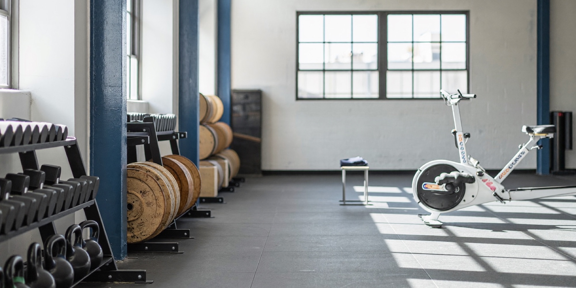 The training floor of a boutique gym, where every membership offer promises the same dream outcome