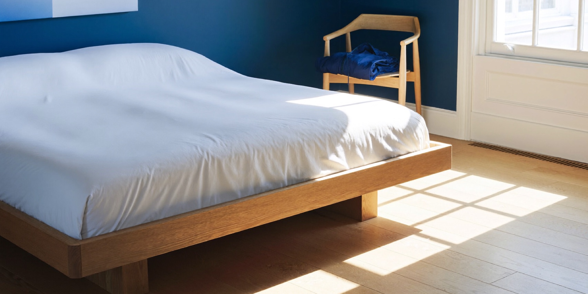 An executive bedroom in early morning light, where the eight hours that come first in the routine are spent