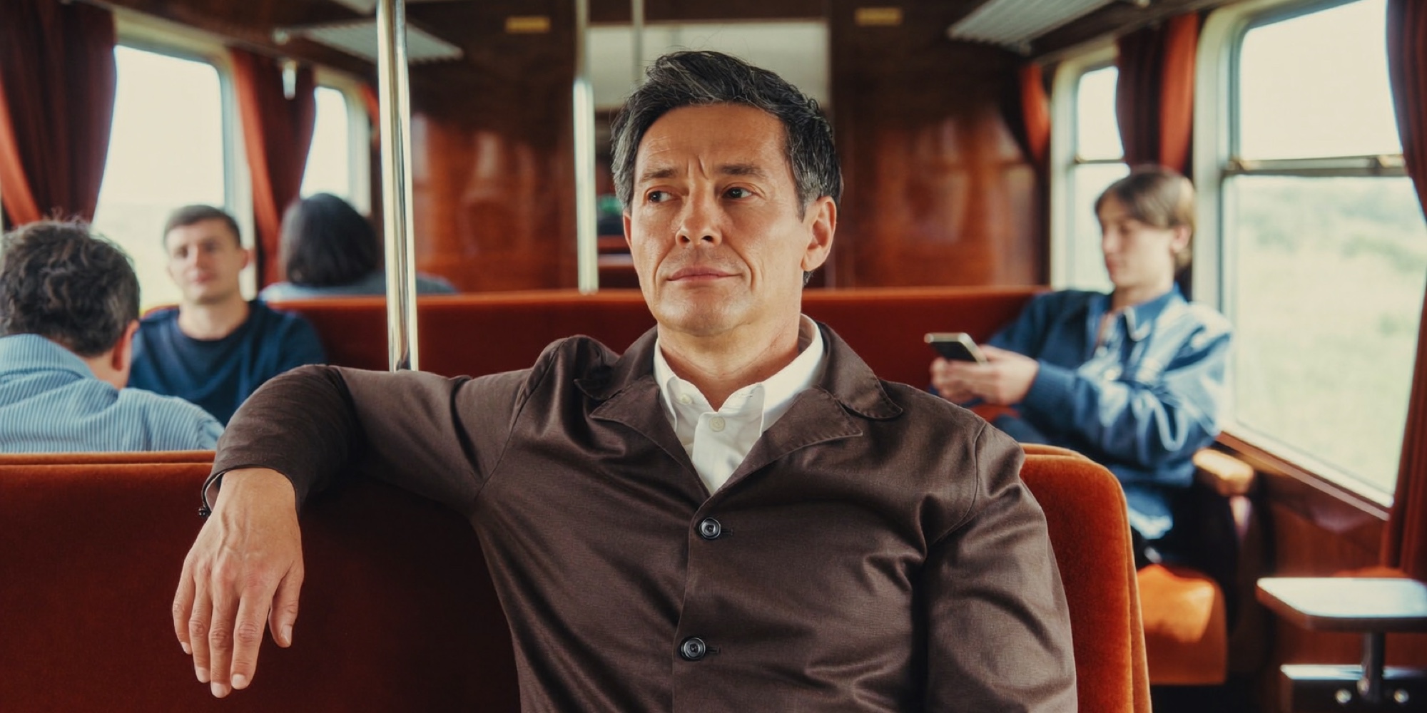 An executive on the train home running the day's names and numbers through his head one more time