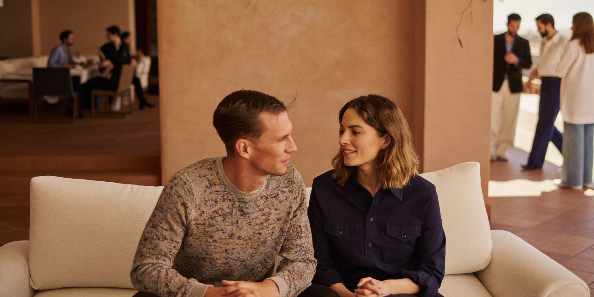 A couple talking through which account their next savings should go into