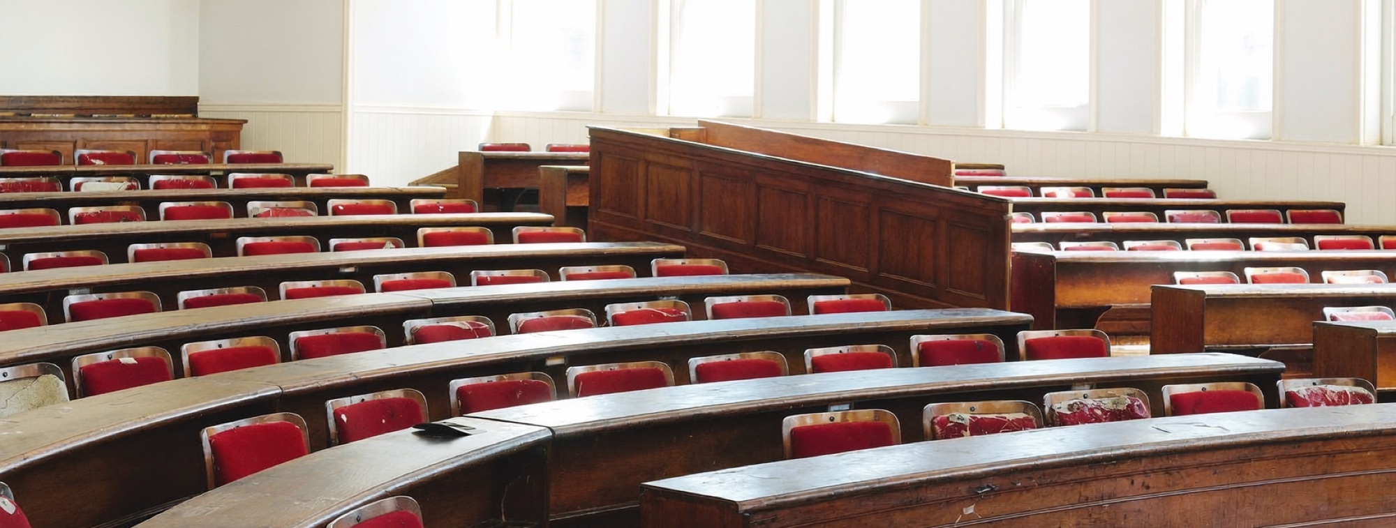 An empty business school lecture theatre, the room an online student rarely sits in