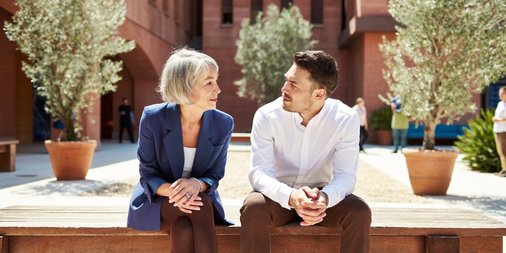 A senior manager teaching a younger colleague, the cheapest form of upskilling