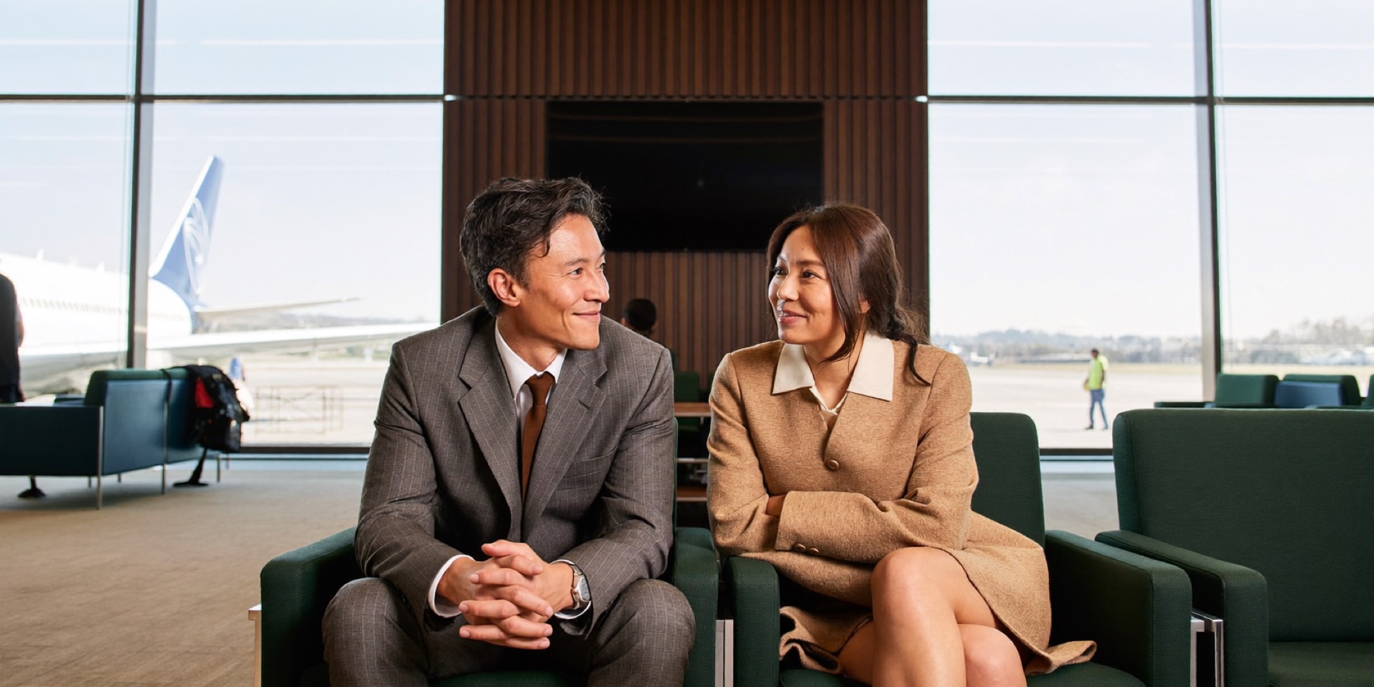 Two executives comparing consulting proposals between flights