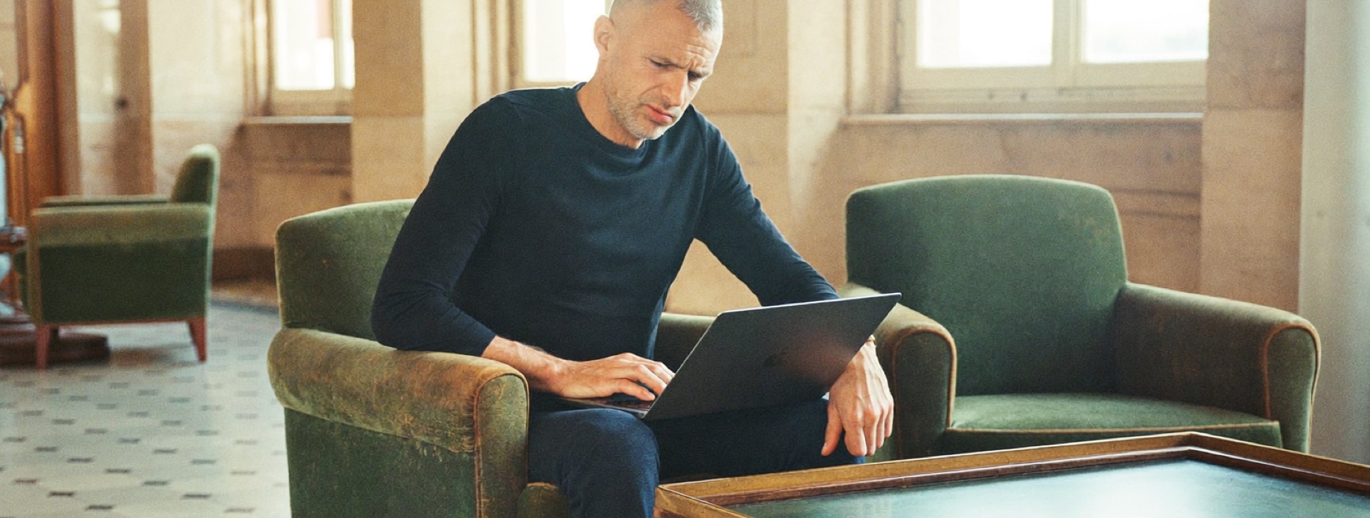 A businessman reviewing a printed document before sending it, the final check AI drafts still need