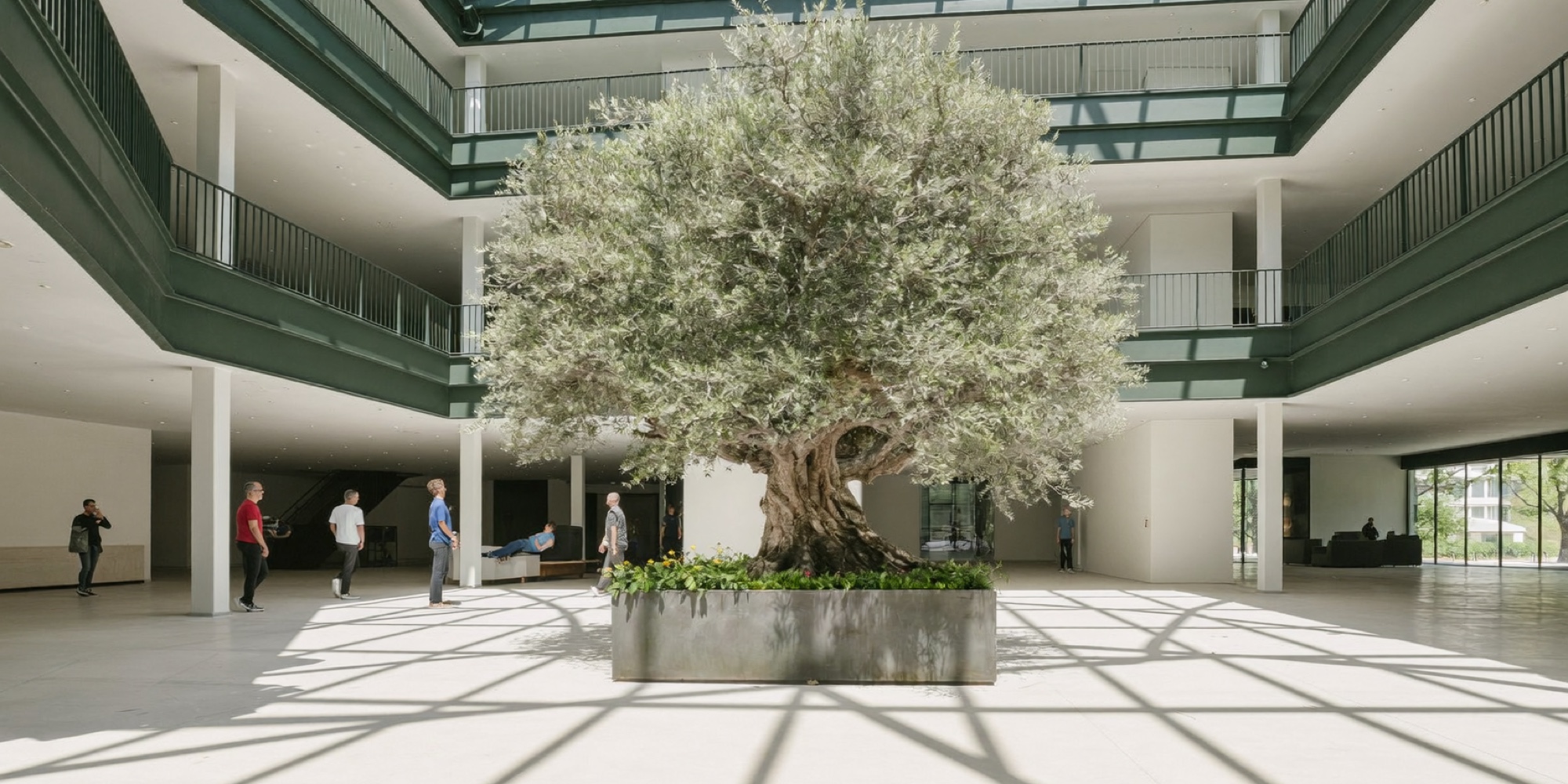 An empty headquarters atrium early in the day, before the first meeting fills it