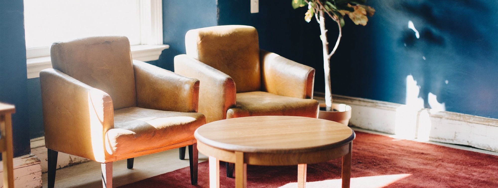 Two armchairs in an adviser's waiting room, where the conversations software struggles with take place