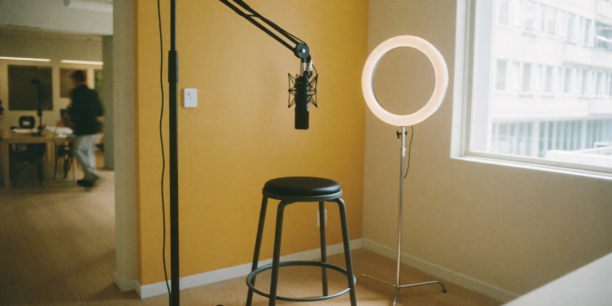 A quiet recording corner in an office, the kind of setup an operator needs about twice a week and no more