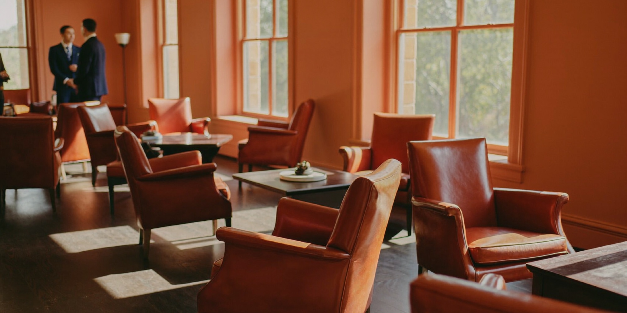 Empty armchairs set in a circle, ready for a team premortem