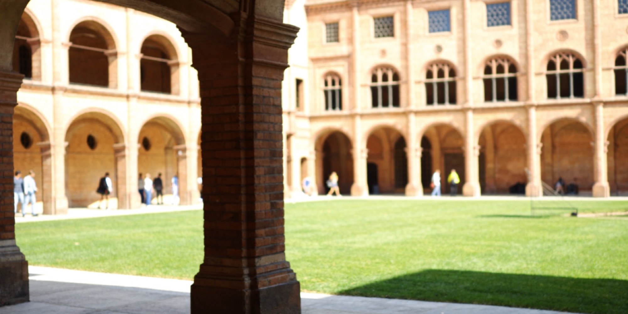 A brick university courtyard, where much of the research behind these books was done