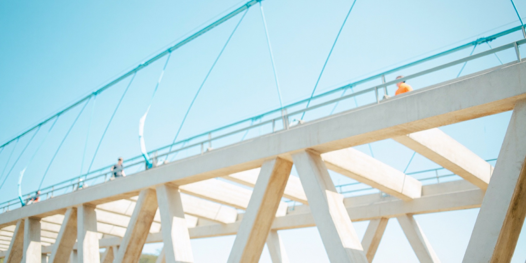 The structure of a bridge, the concrete detail that holds an abstract idea up