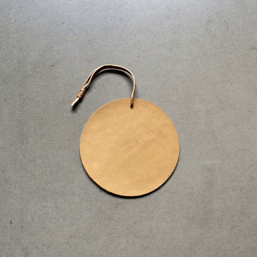 A worn leather bookmark, kept for the books worth a second read