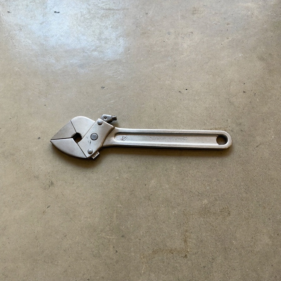 A steel adjustable spanner, a tool sized to the job, like a fractional CFO