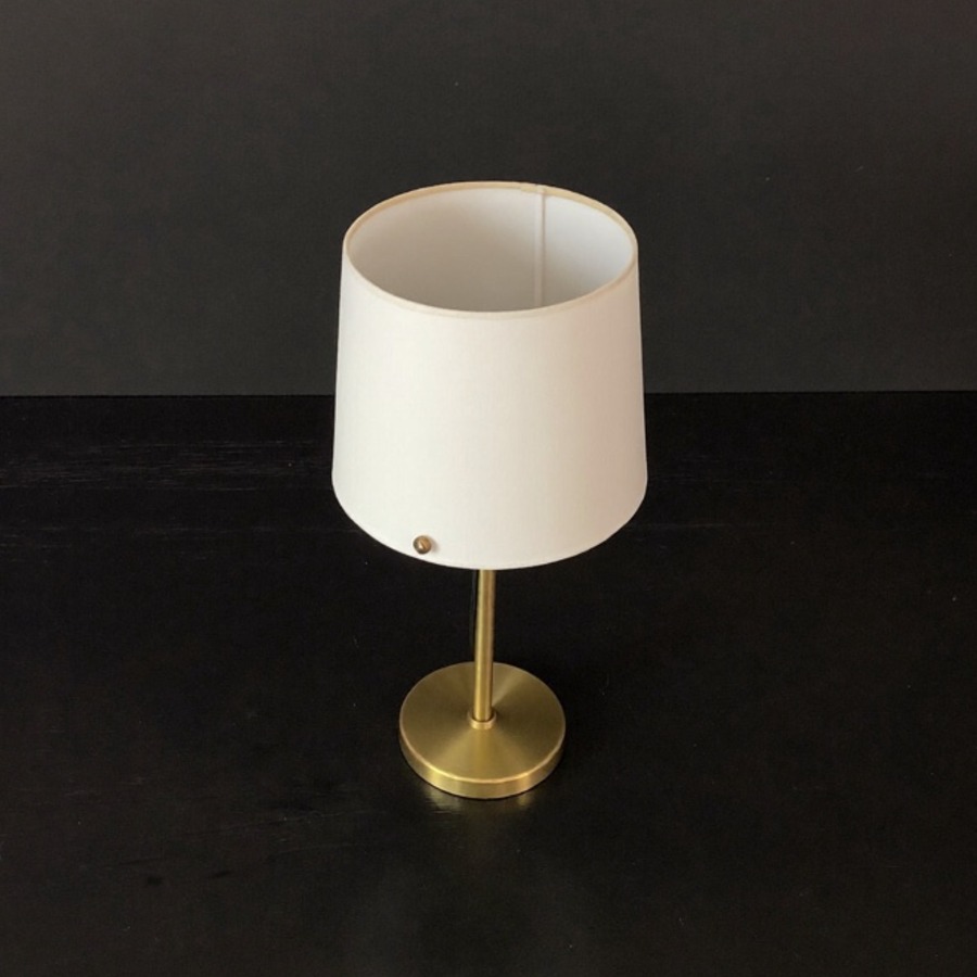 A brass bedside lamp, for the sleep schedule behind any daily routine
