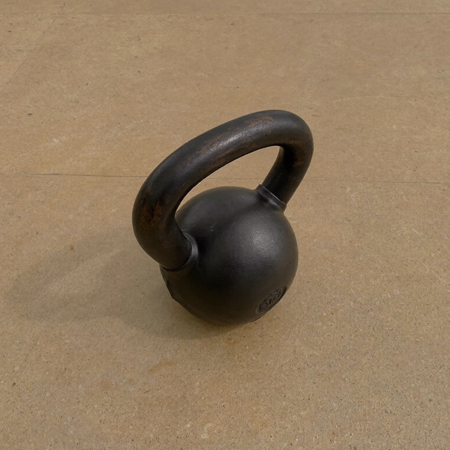 A cast-iron kettlebell, for an article on the Hormozi value equation and the gym business it came from
